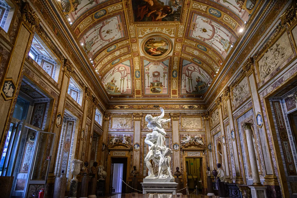 Sculpture beneath a painted ceiling in the Borghese Gallery